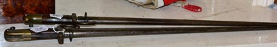 Lot 234 - Two 19th century French sabre bayonets, with sheaths, inscribed (2)