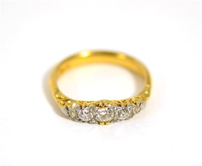 Lot 252 - A graduated diamond ring, soldered to a 22 carat gold band ring