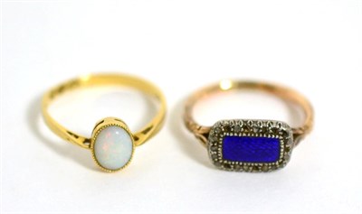 Lot 258 - An enamel and diamond ring and an 18 carat gold opal ring (2)