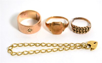 Lot 261 - A diamond set band ring, a signet ring, another ring (cut) and a bracelet (4)