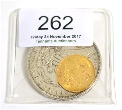 Lot 262 - An 1899 half sovereign together with an 1886 American one dollar coin