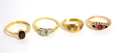 Lot 272 - A 22 carat gold garnet ring, an 18 carat gold cubic zirconia ring and two other rings (a.f.) (4)