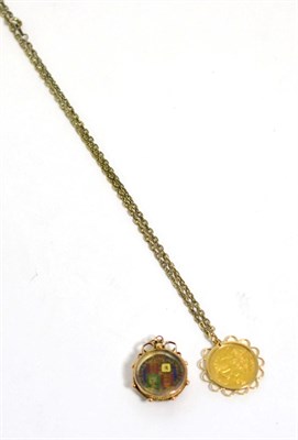 Lot 297 - A 1909 half sovereign mounted as a pendant on a gilt metal chain, and an enamelled Victorian...