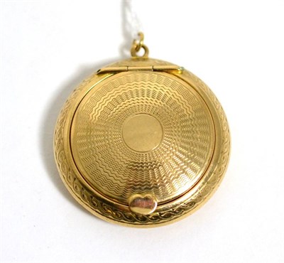 Lot 304 - A 9 carat gold engine turned compact pendant, 4.5cm in diameter