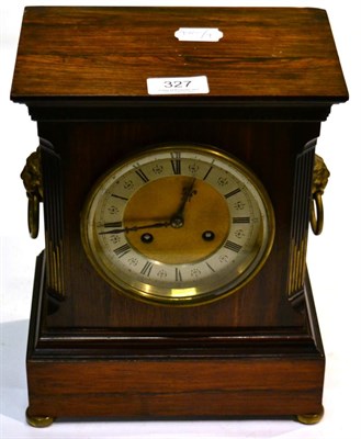 Lot 327 - A rosewood striking mantel clock, circa 1900, with drop ring lion mask handles