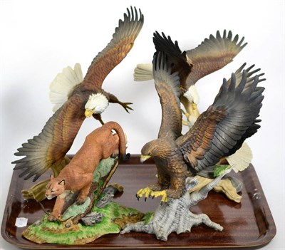 Lot 353 - Brooks & Bentley a set of three porcelain models of eagles and a similar wild cat