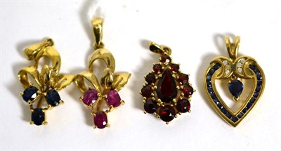 Lot 372 - A 9 carat gold sapphire set pendant, a matching ruby set example, a garnet set pendant and a...