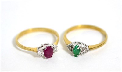 Lot 375 - A 9 carat gold ruby and diamond three stone ring, total estimated diamond weight 0.20 carat...