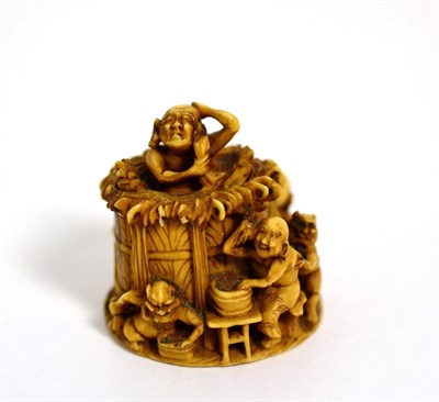 Lot 377 - A Japanese carved ivory netsuke, Meiji period, depicting figures and demons bathing, signed to base