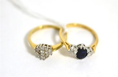 Lot 387 - A 9 carat sapphire and diamond three stone ring, total estimated diamond weight 0.10 carat...