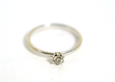 Lot 389 - A solitaire diamond ring, a round brilliant cut diamond in a claw setting, stated diamond...