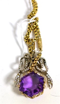 Lot 390 - An amethyst and seed pearl pendant on chain necklace a hexagonal cut amethyst within a border...