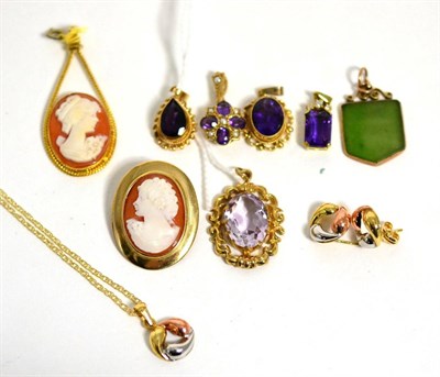 Lot 394 - Four amethyst pendants, a cameo brooch, a cameo pendant, a nephrite pendant and a tri-colour...