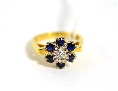 Lot 399 - An 18 carat gold diamond and sapphire cluster ring, estimated diamond weight 0.10 carat...