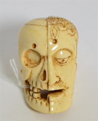 Lot 412 - A carved bone memento Mori cane handle