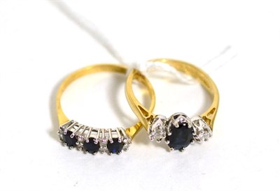 Lot 422 - A 9 carat sapphire and diamond three stone ring, total estimated diamond weight 0.10 carat...