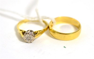 Lot 423 - An 18 carat gold band ring and an 18 carat gold diamond solitaire ring