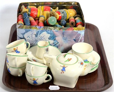 Lot 440 - A childs Little Miss Muffet tea service; and a quantity of painted wooden skittles