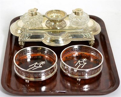 Lot 456 - A desk stand and two plated coasters