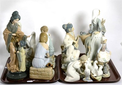 Lot 458 - A large quantity of Lladro, Nao and similar style figures, (some damages) (on two trays)