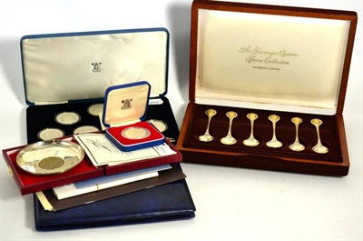 Lot 474 - The Sovereign Queens spoons, a set of six commemorative parcel gilt spoons, with certificate...