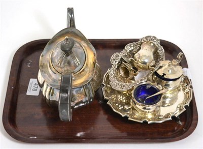 Lot 478 - A silver teapot; a small silver salver or card tray; a three piece cruet set; and a pierced dish