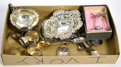 Lot 502 - Assorted silver items to include a cream jug; napkin rings; a George III silver port wine...