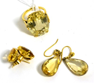 Lot 513 - A citrine ring, stamped '9CT', size I1/2 and two pairs of citrine earrings (3)