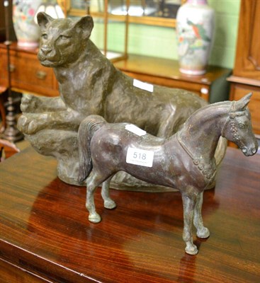 Lot 518 - A bronze model of a horse and a composition model of a ";Lazy Leopard"; by Eric Heron dated 1993