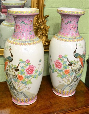 Lot 523 - A pair of large famille rose decorated vases