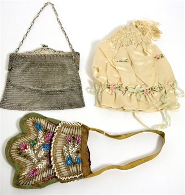 Lot 547 - Early 19th century cream silk draw string bag, decorated with rosebuds and silk tassel;...