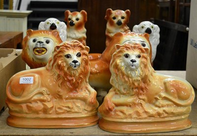 Lot 1002 - Two pairs of 19th century Staffordshire lions and two pairs of Staffordshire dogs (a.f.) (8)