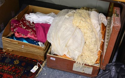 Lot 1050 - A suitcase and a box containing 19th century and later adults and children's clothing