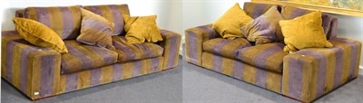 Lot 1097 - A pair of good quality sofas, upholstered in purple and mustard striped velvet, comprising a...