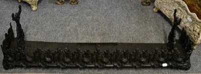 Lot 1098 - A decorative black painted fire curb of Gothic design; and a cast fire insert/grate, stamped...