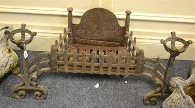 Lot 1099 - A 19th century cast iron dog grate