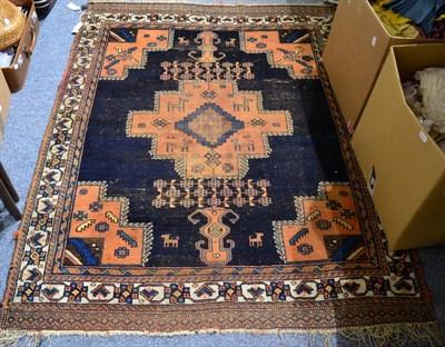 Lot 1102 - An Afshar rug, South West Iran, the deep indigo field with cruciform medallion framed by...