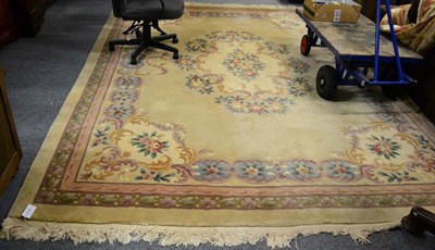 Lot 1107 - Chinese Savonneries design carpet, the pale carved field with central floral medallion enclosed...