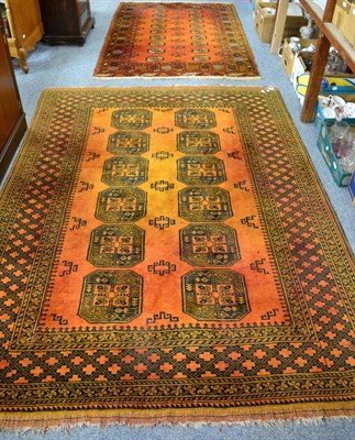 Lot 1110 - Turkman carpet, North Afghanistan, the rust field of elephant foot design enclosed by chequered...