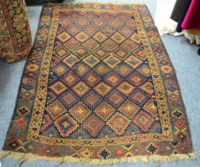 Lot 1116 - A late 19th century Jaff Kurd rug, Sanjabi, the indigo field of stepped lattice design enclosed...