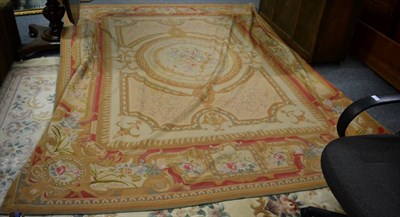 Lot 1118 - A needlepoint carpet of Aubusson design, China, the corn field with central floral medallion framed