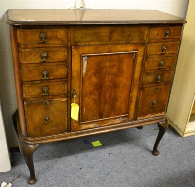 Lot 1119 - A walnut cocktail cabinet