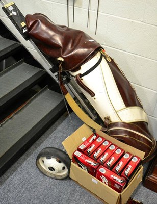 Lot 1125 - Golf clubs in trolley and a box of golf balls