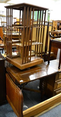 Lot 1139 - A revolving bookcase and a 1920's oak table