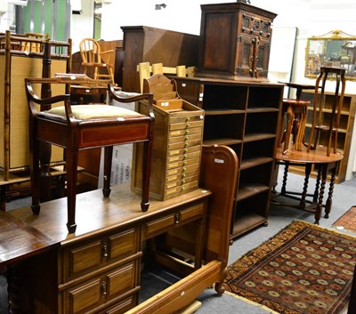 Lot 1140 - A group of furniture comprising of an oak open bookcase, a modern dressing table, an early 20th...