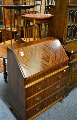 Lot 1142 - A 19th century mahogany tilt top tripod table, a reproduction bureau, similar plant stand and...