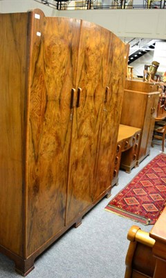 Lot 1152 - A 1950's three piece walnut bedroom suite