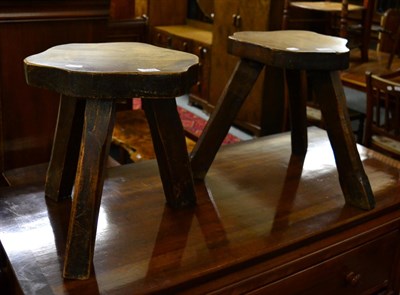 Lot 1159 - A pair of elm stools