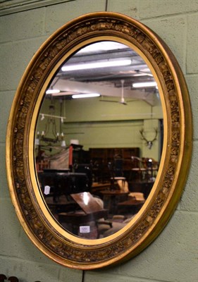 Lot 1251 - A gilt oval mirror