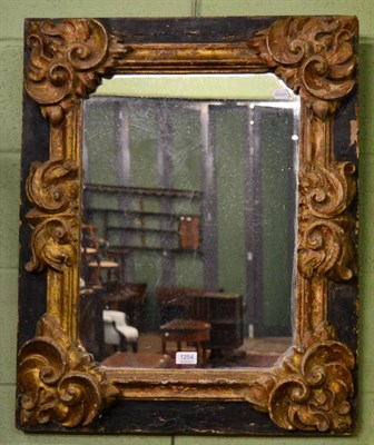 Lot 1254 - Gilt and black painted carved wood rectangular wall mirror